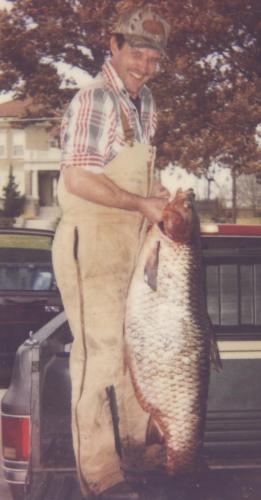 Jim Shull holds his state record grass carp