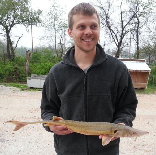 Joe McMullen holds his state record shovelnose sturgeon